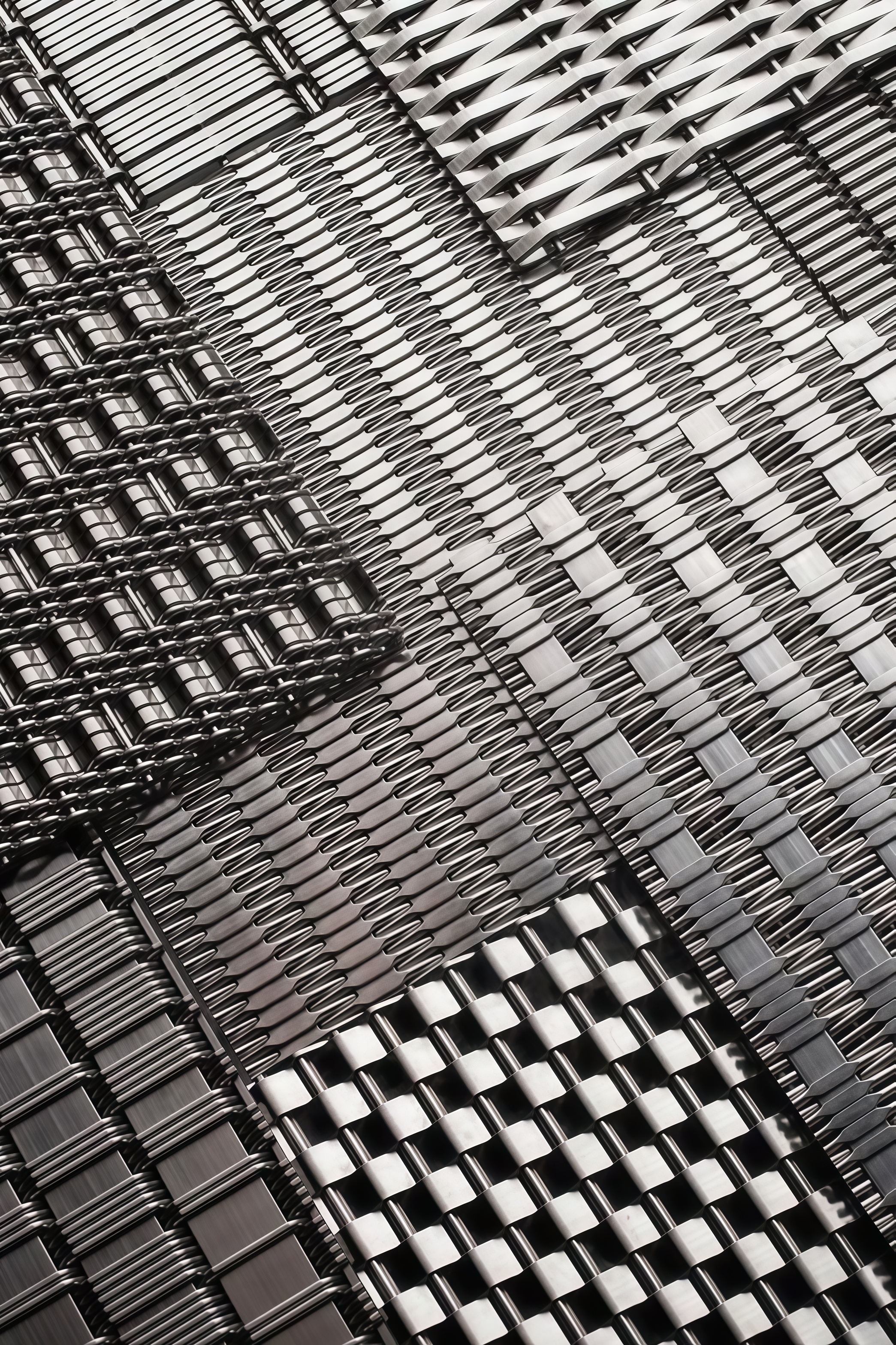 Architectural space shaped with metal mesh surfaces